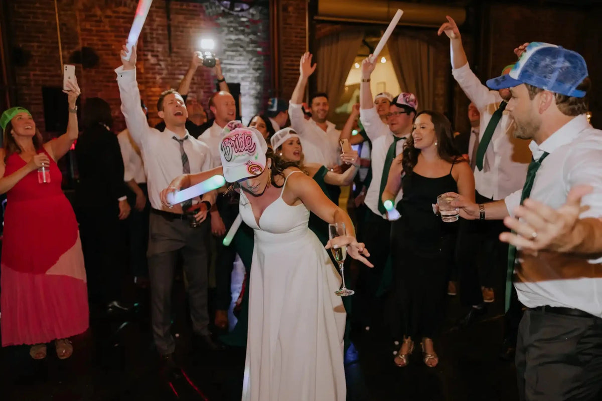 A group of people dancing and celebrating at a party.